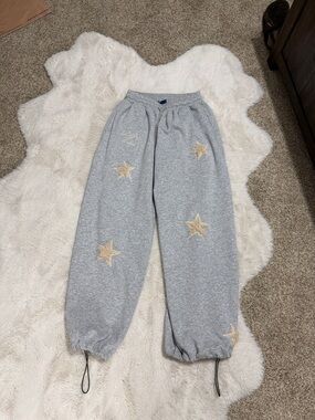 Aelfric Eden Gray Sweatpants with Gold Star Appliqués